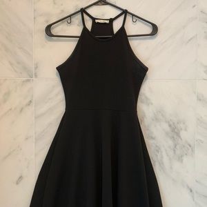 Women’s long, black, polyester dress.